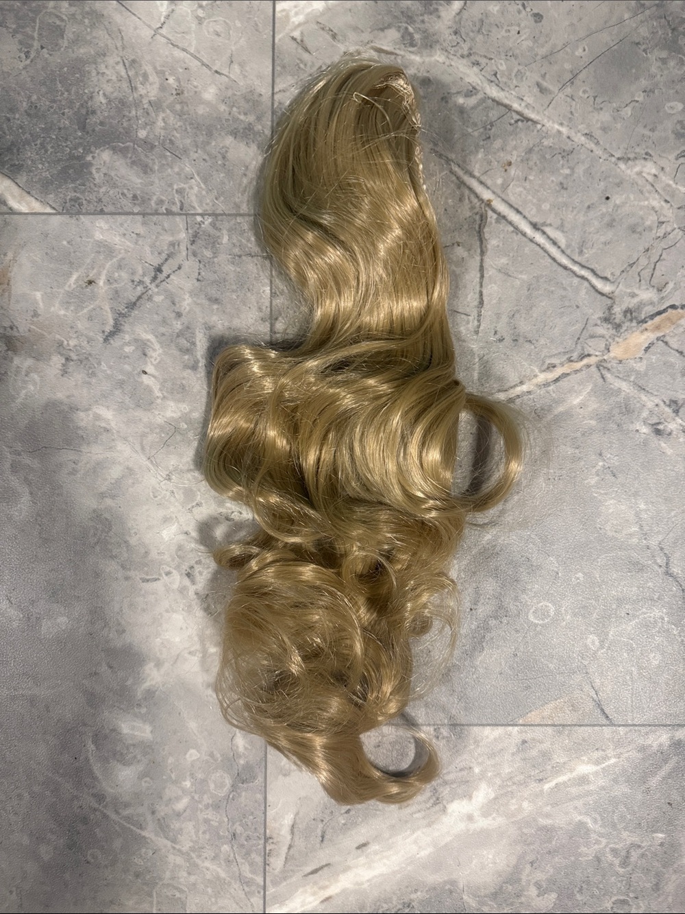 2/$30. 24” Synthetic Blonde Wavy Clip-In Ponytail Extension
